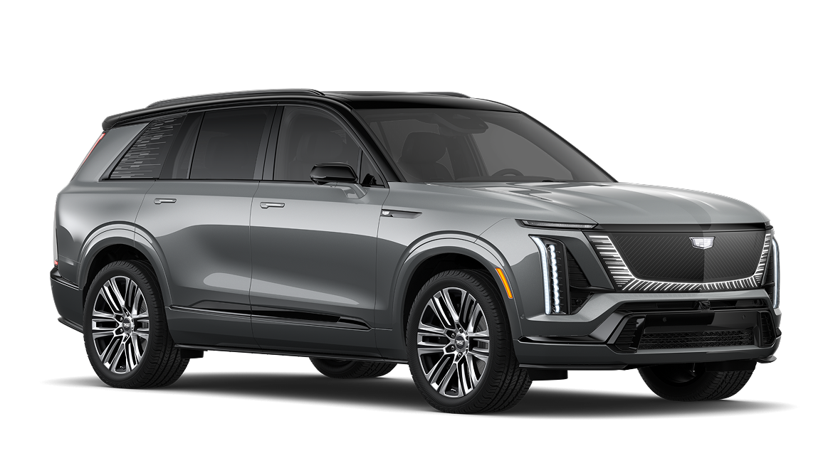 Front three-quarter view of a silver metallic 2025 Cadillac VISTIQ with signature vertical LED lights and luxury styling.