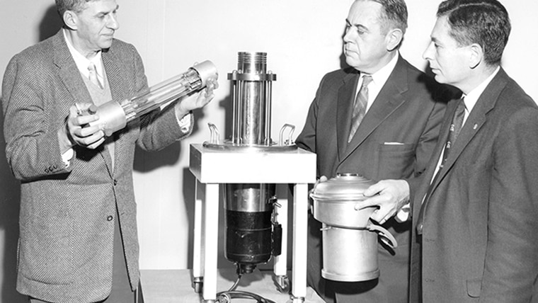 GM researchers in the 1950s examining a vaccine purifying machine.