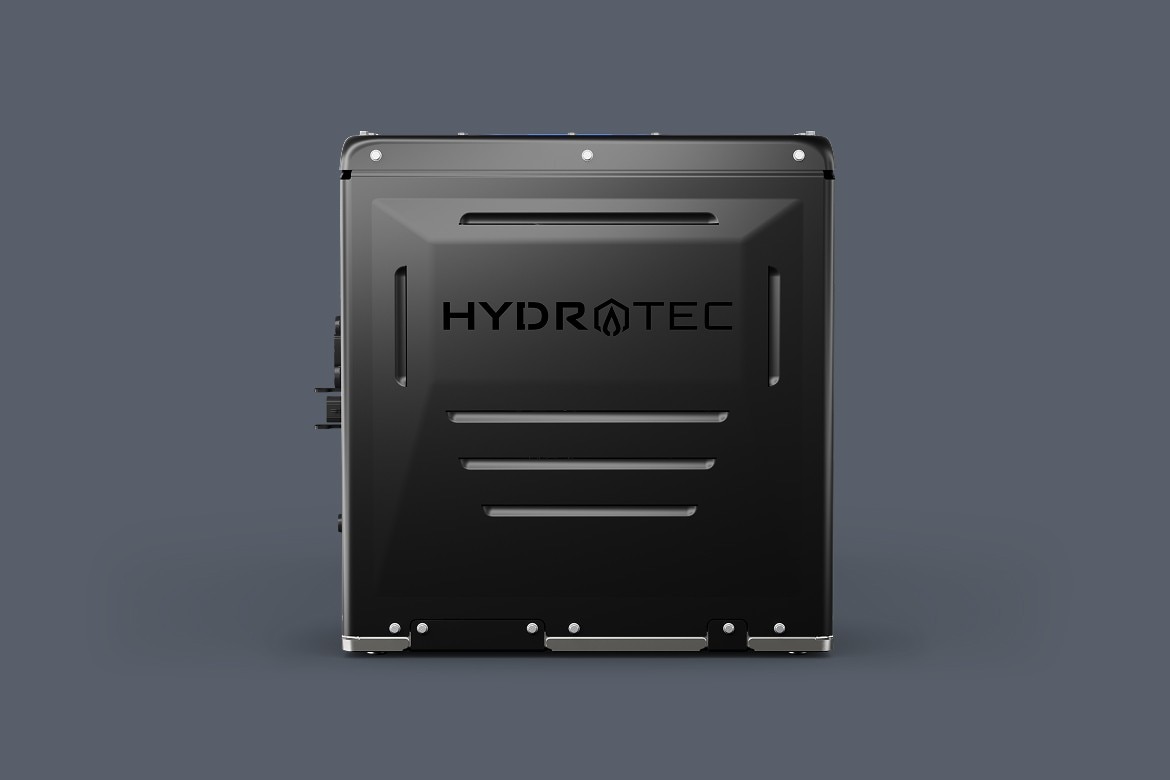 Front view of a hydrogen fuel cell power cube, featuring a matte black exterior with the HYDROTEC logo centered on the panel.